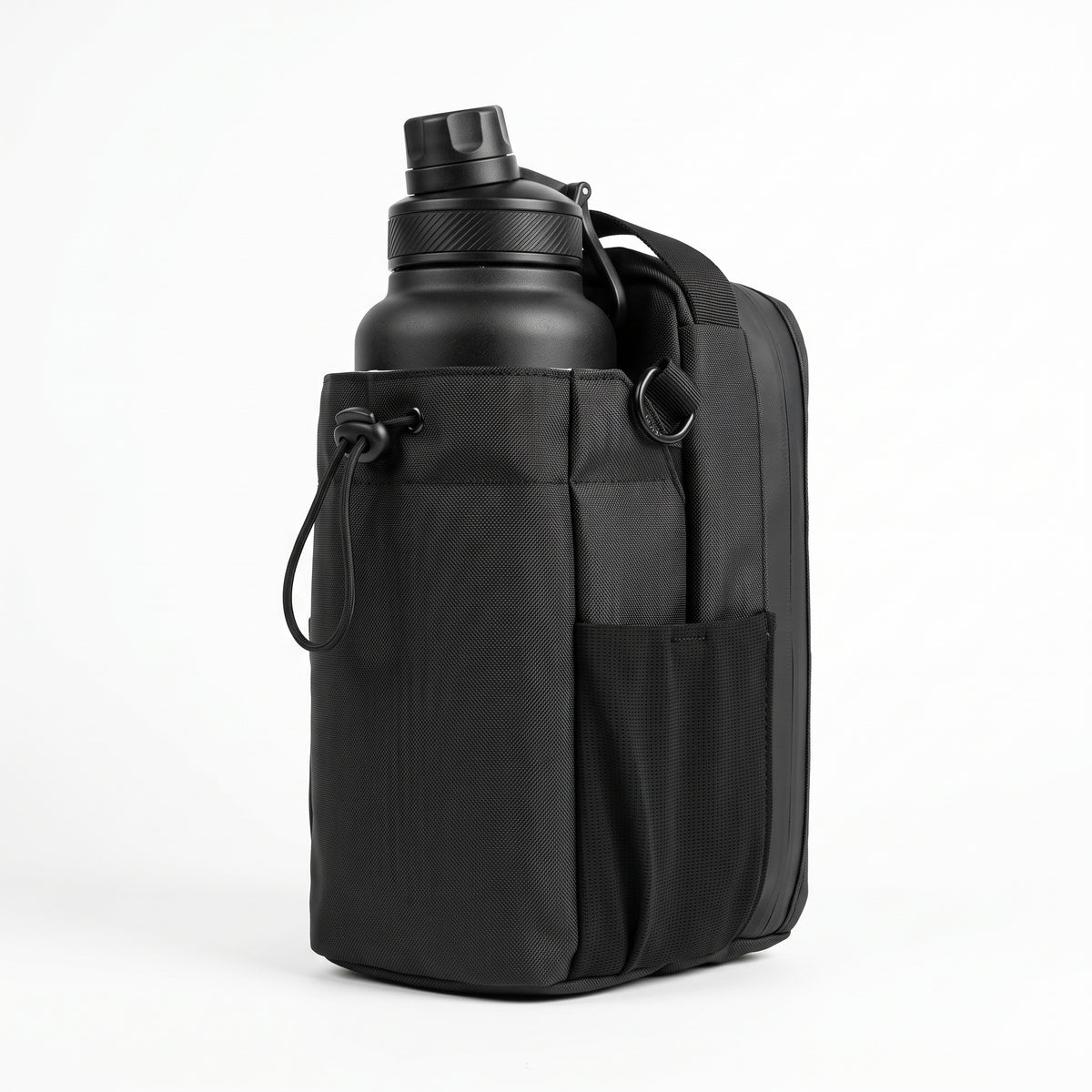 A flattering 3/4 front view of the all-black Aveliques Magnetic Gym Bag holding a large water bottle, with phone and accessory pockets visible, on a pure white studio background.